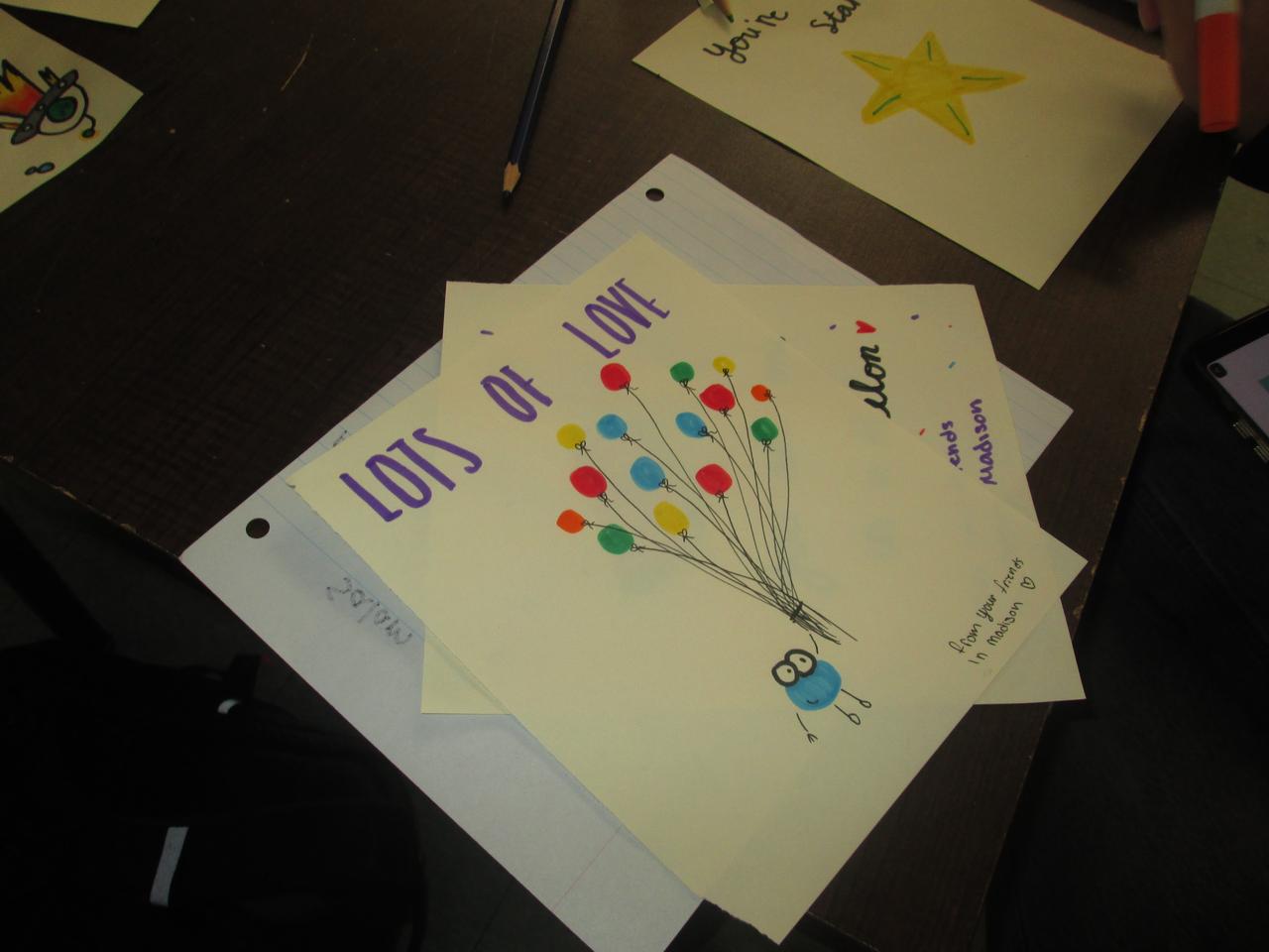 Hand-drawn flowers and messages of support